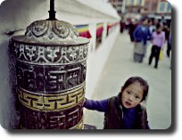 prayer wheel and girl